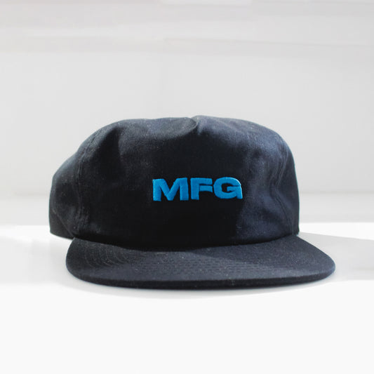 Black Cotton flat bill hat with Teal MFG Logo.